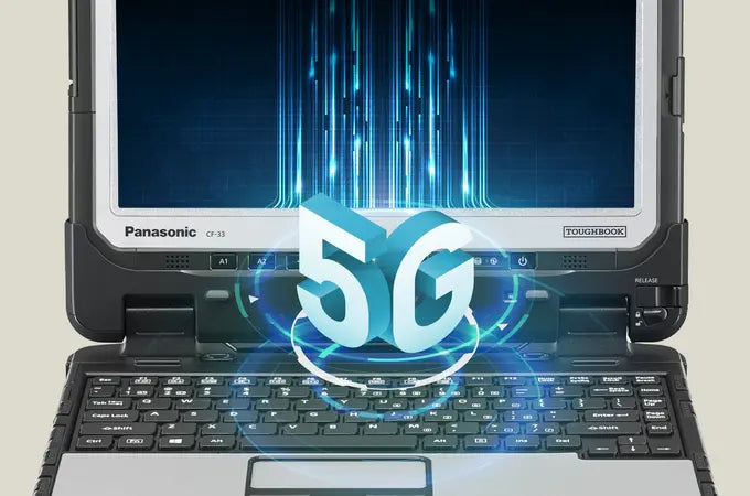 Panasonic Toughbook laptop shown open against a light beige background, with a large glowing blue 5G graphic overlaid in front of the screen and keyboard.